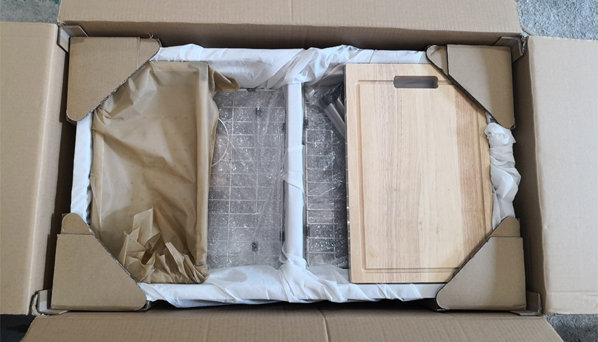 Packaged stainless steel sink with accessories in carton